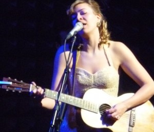 Jill Barber, playing left-handed guitar